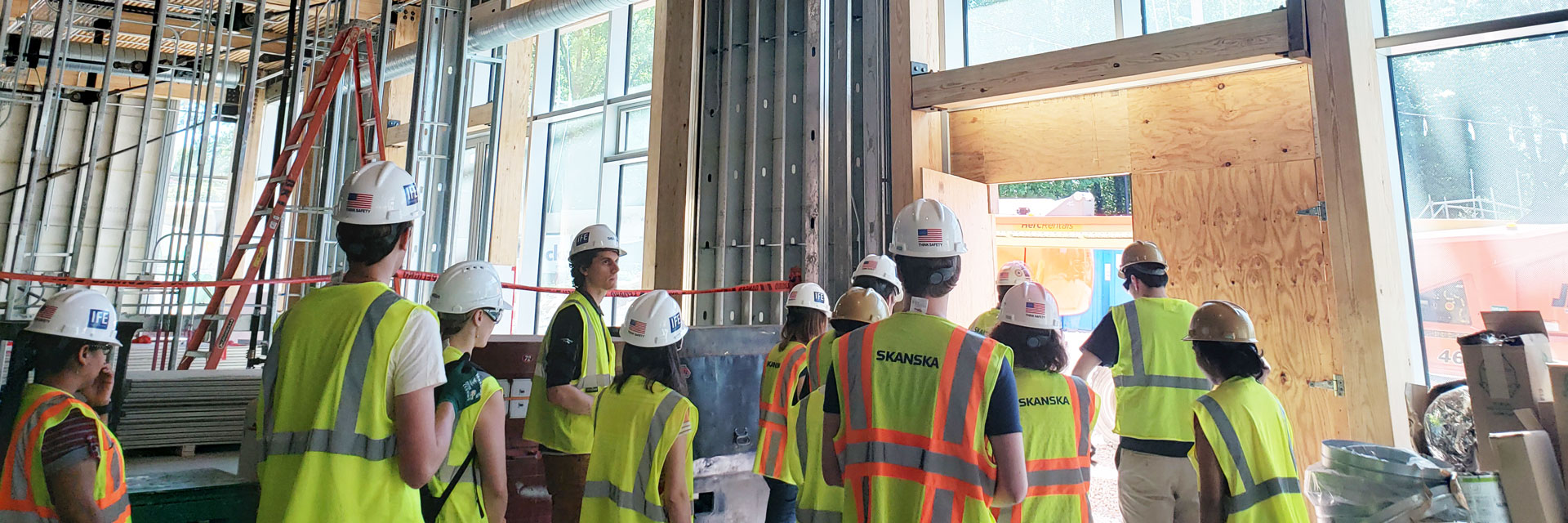 Students at construction site tour of the Kendeda Building.