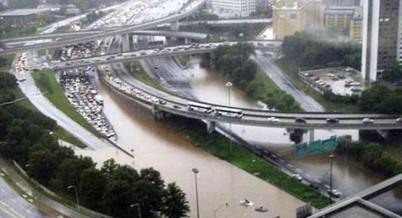 Heavy rain and flood shuts down major highway causing traffic jam. 