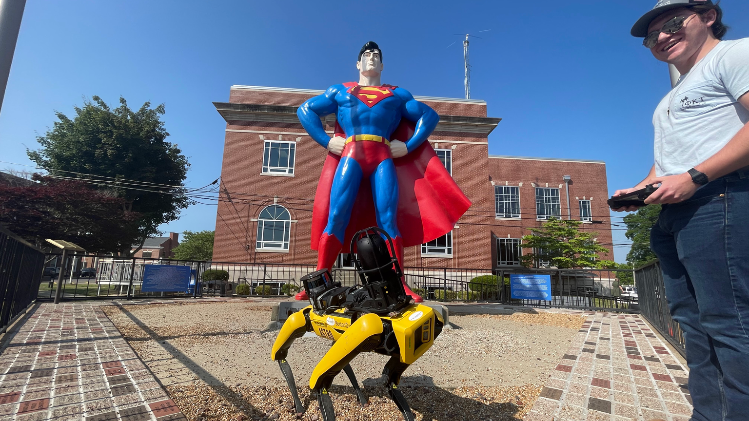Astro in front of Superman statue in Metropolis, Illinois